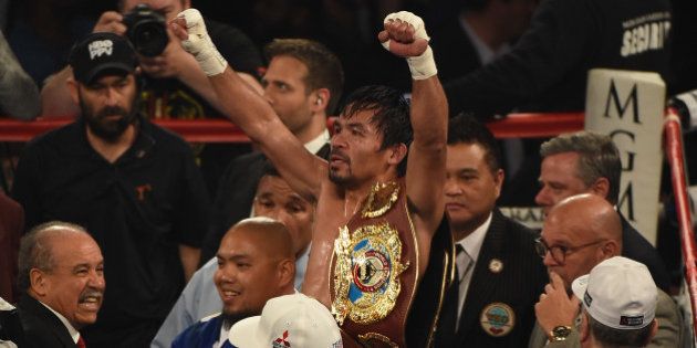 LAS VEGAS, NEVADA - APRIL 09: Manny Pacquiao celebrates after defeating Timothy Bradley Jr. in their welterweight fight on April 9, 2016 at MGM Grand Garden Arena in Las Vegas, Nevada. Pacquiao won by unanimous decision. (Photo by Ethan Miller/Getty Images)