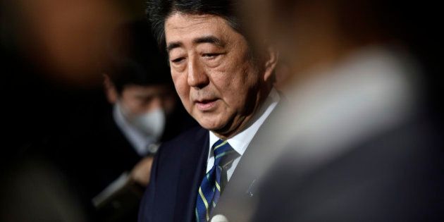 Japanese Prime Minister Shinzo Abe speaks to reporters condemning the terror attacks in Belgium, at Abe's official residence in Tokyo, Tuesday, March 22, 2016. Explosions rocked the Brussels airport and the subway system Tuesday, just days after the main suspect in the November Paris attacks was arrested in the city, police said.(Franck Robichon/Pool Photo via AP)
