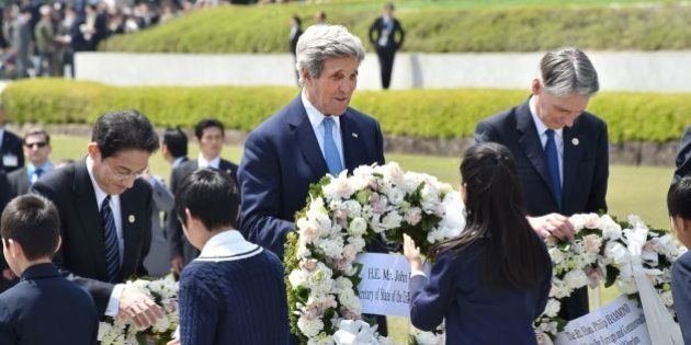 US Secretary of State John Kerry (C), Japan's Foreign Minister Fumio Kishida (R) and British Foreign Secretary Philip Hammond receive wreaths to offer at the Memorial Cenotaph for the 1945 atomic bombing victims in the Peace Memorial Park, on the sidelines of the G7 Foreign Ministers' Meeting in Hiroshima on April 11, 2016.Kerry and other G7 foreign ministers made the landmark visit on April 11 to the memorial site for the world's first nuclear attack in Hiroshima. / AFP / POOL / Kazuhiro NOGI (Photo credit should read KAZUHIRO NOGI/AFP/Getty Images)