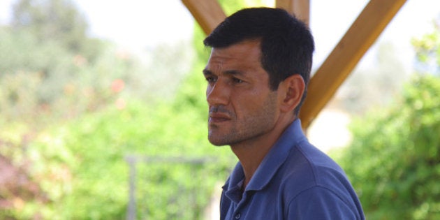 Abdullah Kurdi, 40, father of Syrian boys Aylan, 3, and Galip, 5, who were washed up drowned on a beach near Turkish resort of Bodrum on Wednesday, waits for the delivery of their bodies outside a morgue in Mugla, Turkey, Thursday, Sept. 3, 2015.(AP Photo/Mehmet Can Meral)