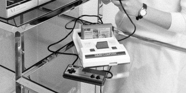 JAPAN: A model plays Nintendo's Family Computer on January 30, 1985 in Japan. Family Computer was on...