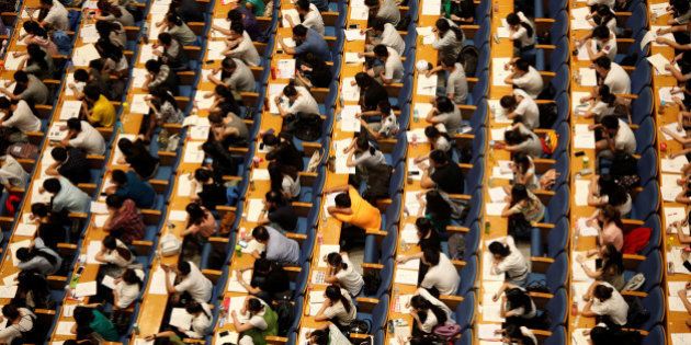 Students attend a lecture for the entrance exam for postgraduate studies at a hall in Jinan, Shandong Province, China, July 18, 2016. Picture taken July 18, 2016. China Daily/via REUTERS ATTENTION EDITORS - THIS IMAGE WAS PROVIDED BY A THIRD PARTY. EDITORIAL USE ONLY. CHINA OUT.