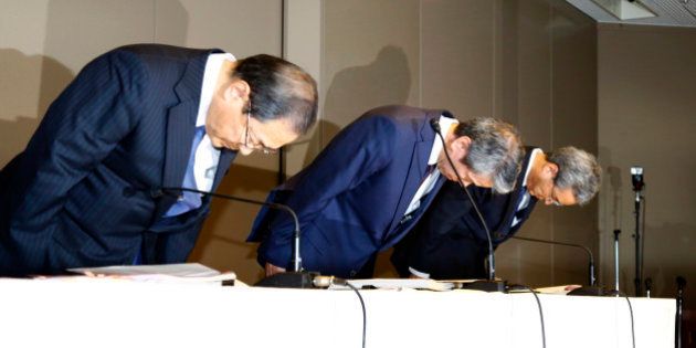 Toshiba Corp. CEO Hisao Tanaka, center, bows with chairman Tadashi Muromachi, left, and executive director Keizo Maeda during a press conference to announce his resignation at the company's headquarters in Tokyo, Tuesday, July 21, 2015. Tanaka stepped down Tuesday to take responsibility for doctored books that inflated profits at the Japanese technology manufacturer by 151.8 billion yen ($1.2 billion). Toshiba acknowledged a systematic cover-up, which began in 2008, as various parts of its sprawling business including computer chips and personal computers were struggling financially, but top managers set unrealistic earnings targets under the banner of âchallenge.â (AP Photo/Shizuo Kambayashi)