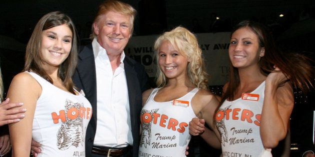 ATLANTIC CITY, NJ - SEPTEMBER 01: Donald J.Trump poses with Hooters Girls at the Donald Trump's Ultimate Deal Cash Giveaway at the Trump Marina Hotel and Casino on September 1, 2007 in Atlantic Ciyt, New Jersy. (Photo by Nick Valinote/FilmMagic)