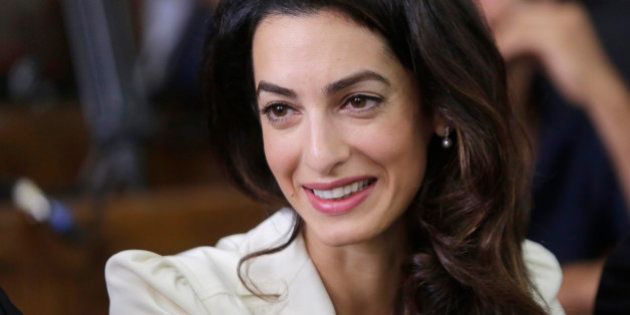 Amal Clooney, a member of the legal team representing Canadian Al-Jazeera English journalist Mohammed Fahmy sits in a courtroom in Tora prison in Cairo, Egypt, Saturday, Aug. 29, 2015. An Egyptian court on Saturday sentenced three Al-Jazeera English journalists to three years in prison, the last twist in a long-running trial criticized worldwide by press freedom advocates and human rights activists. (AP Photo/Amr Nabil)