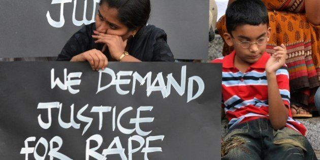 Activists from various women's rights organisation and children stage a silent demonstration against sexual assault and rapes on women, in Bangalore on April 22, 2015. AFP PHOTO/Manjunath KIRAN (Photo credit should read MANJUNATH KIRAN/AFP/Getty Images)