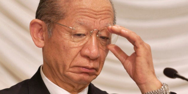 JAPAN - NOVEMBER 15: Toshiba Corp. Chairman Taizo Nishimuro adjusts his glasses at a press briefing at the 41st Japan-U.S. Business Conference in Tokyo on Monday, November 15, 2004. (Photo by Michael Caronna/Bloomberg via Getty Images)