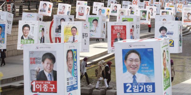 Election posters of 376 candidates for Seoul's constituencies in the April 13 general elections are hung on string over the Cheonggye Stream in Seoul, South Korea, Monday, April 4, 2016. The display made by the city's election management committee is aimed at encouraging people to vote in the elections. (AP Photo/Ahn Young-joon)