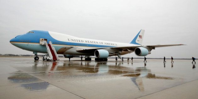 Journalists board Air Force One at Joint Base Andrews in Maryland U.S. December 6, 2016, on the morning that U.S. President-elect Donald Trump urged the government to cancel purchase of Boeing's new Air Force One plane saying it was