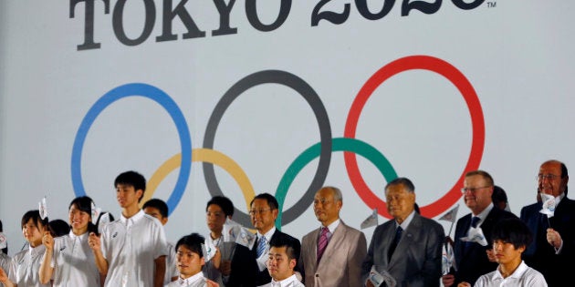 International Olympic Committee Vice President John Coates, second right, and Tokyo 2020 Summer Olympic Organizing Committee President Yoshiro Mori third right, pose for photographers in front of official emblems of the Tokyo 2020 Olympic Games at Tokyo Metropolitan Plaza in Tokyo, Friday, July 24, 2015. (AP Photo/Shizuo Kambayashi)