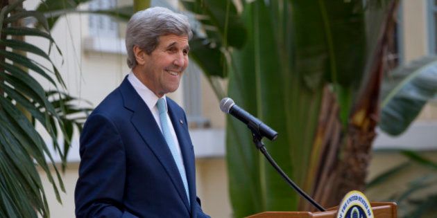 U.S. Secretary of State John Kerry smiles as he arrive to speak to members of the media in Phnom Penh, Cambodia, Tuesday, Jan. 26, 2016. Kerry is in Cambodia on the fourth leg of his latest round-the-world diplomatic mission, which will also take him to China. (AP Photo/Jacquelyn Martin, Pool)