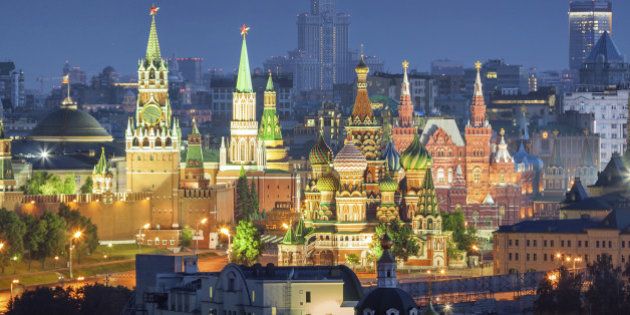 Night view of the Moscow Kremlin, Red Square and St. Basil's Cathedral from the residential house rooftop.
