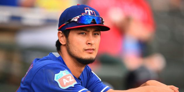 SURPRISE, AZ - MARCH 06: Yu Darvish of Texas Rangers looks on before the spring training game between Texas Rangers and Seattle Mariners at Surprise Stadium on March 6, 2016 in SURPRISE,AZ, United States. (Photo by Masterpress/Getty Images)