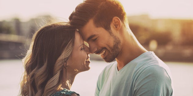 Happy couple enjoy spending time together.Image is intentionally toned.