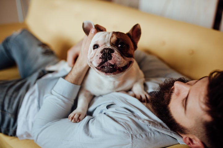 Man embracing his dog