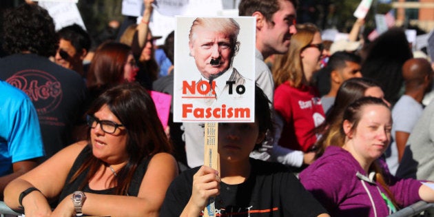 HOUSTON, TX - JANUARY 29: Protestors fill the street outside the NFL Experience at the George R. Brown Convention Center on January 29, 2017, in Houston, Texas. Protestors hold up signs denouncing President Donald Trumps ban on Muslims. (Photo by Rich Graessle/Icon Sportswire via Getty Images)