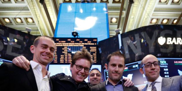 Twitter CEO Dick Costolo (R) celebrates the Twitter IPO with Twitter founders Jack Dorsey (L), Biz Stone (2nd L) and Evan Williams on the floor of the New York Stock Exchange in New York, November 7, 2013. REUTERS/Brendan McDermid (UNITED STATES - Tags: BUSINESS SCIENCE TECHNOLOGY)