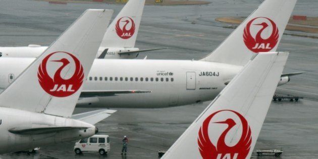Japan Airlines passenger planes are seen on the runway at Haneda airport in Tokyo on January 29, 2016. Japan Airlines announced its 9-month profit soared 20 percent, as the carrier benefited from a surge in tourism and low fuel costs. AFP PHOTO / Toru YAMANAKA / AFP / TORU YAMANAKA (Photo credit should read TORU YAMANAKA/AFP/Getty Images)