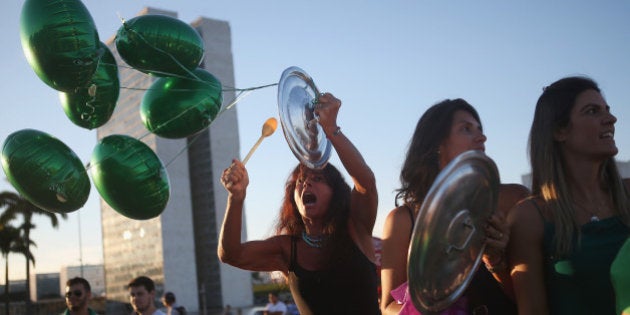 BRASILIA, BRAZIL - MARCH 21: Anti-government protestors chant outside the National Congress on March 21, 2016 in Brasilia, Brazil. Protestors rallied against Brazilian President Dilma Rousseff amidst a massive corruption scandal in the country. (Photo by Mario Tama/Getty Images)