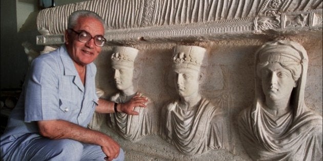 SYRIA - SEPTEMBER 01: Palmyra's Last Treasures in Syria in September, 2002 - Khaled al-Asaad, the Director of Antiquities and Museum in Palmyra, in front of a rare sarcophagus depicting two priests (they wear the typical cylindrical cap), a father and his son, one with his wife and the other one with his sister. Dating from the 1st century, it is one of the finest sculptures in Palmyra. (Photo by Marc DEVILLE/Gamma-Rapho via Getty Images)