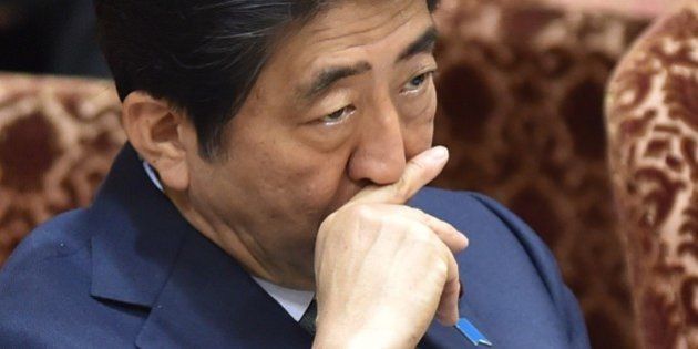 Japan's Prime Minister Shinzo Abe attends a special committee session in the upper house of parliament in Tokyo on August 21, 2015. The upper house continued to deliberate over controversial security bills which would expand the remit of the country's armed forces. Controversial security bills that opponents say will undermine 70 years of pacifism and could see Japanese troops fighting abroad for the first time since World War II passed through the powerful lower house of parliament in July. AFP PHOTO / KAZUHIRO NOGI (Photo credit should read KAZUHIRO NOGI/AFP/Getty Images)