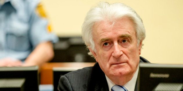 Bosnian Serb wartime leader Radovan Karadzic in the courtroom for the reading of his verdict at the International Criminal Tribunal for Former Yugoslavia (ICTY) in The Hague, The Netherlands Thursday March 24, 2016.The former Bosnian-Serbs leader is indicted for genocide, crimes against humanity, and war crimes. (Robin van Lonkhuijsen, Pool via AP)