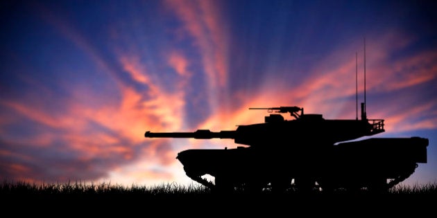 Modern heavy tank isolated in front a sunset