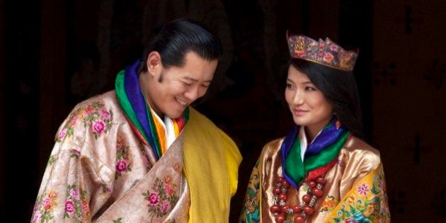 FILE - This Oct. 13, 2011 file photo Queen Jetsun Pema, right, looks at King Jigme Khesar Namgyal Wangchuck as they pose after they were married at the Punakha Dzong in Punakha, Bhutan. The tiny Himalayan nation of Bhutan has a new crown prince. The Royal Media Office in capital Thimphu said Saturday that the baby boy was born on Friday. (AP Photo/Kevin Frayer, File)