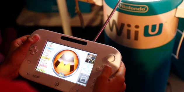 PARIS, FRANCE - OCTOBER 29: A gamer plays the video game 'Mario Kart 8' developed by Nintendo EAD on a games console Nintendo Wii U at Paris Games Week, a trade fair for video games on October 29, 2015 in Paris, France. Paris Games week runs from October 28 until November 1, 2015. (Photo by Chesnot/Getty Images)