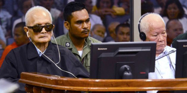 In this photo released by the Extraordinary Chambers in the Courts of Cambodia, the two most senior surviving members of the Khmer Rouge regime Nuon Chea, left, and Khieu Samphan listen to the verdict which upheld their life sentences in Cambodia's top court, Phnom Penh, Cambodia, Wednesday, Nov. 23, 2016. The Supreme Court Chamber said the 2014 verdict by a U.N. assisted Khmer Rouge tribunal was