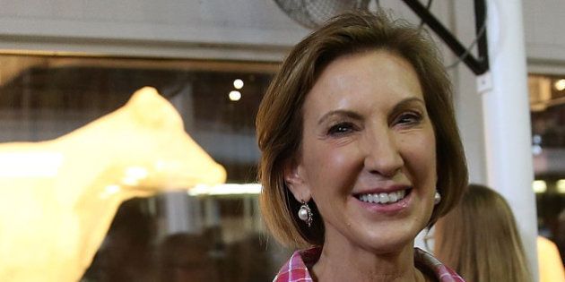 DES MOINES, IA - AUGUST 17: Republican presidential candidate Carly Fiorina poses for a photo in front of the Butter Cow while touring the Iowa State Fair on August 17, 2015 in Des Moines, Iowa. Presidential candidates are addressing attendees at the Iowa State Fair on the Des Moines Register Presidential Soapbox stage and touring the fairgrounds. The State Fair runs through August 23. (Photo by Justin Sullivan/Getty Images)