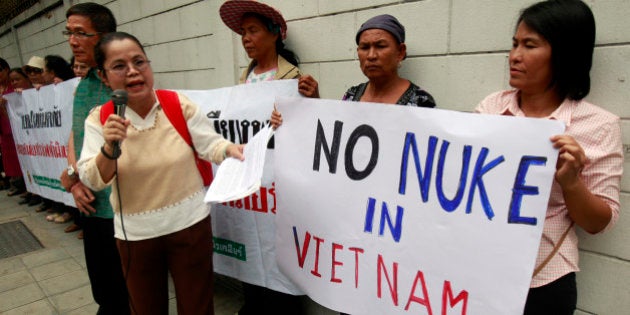 Anti-nuclear activists hold placards during a protest outside the Vietnamese embassy in Bangkok April 26, 2011. Vietnam plans to start the construction of a nuclear plant in 2014 in its Ninh Thuan province, only 800 kilometres (497 miles) away from the northeastern Thai province Ubon Ratchathani. REUTERS/Chaiwat Subprasom (THAILAND - Tags: POLITICS ENERGY CIVIL UNREST)