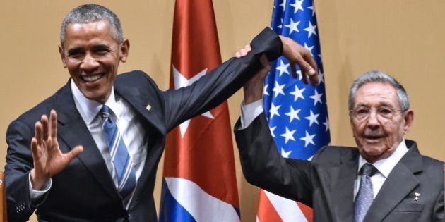 Cuban President Raul Castro (R) raises US President Barack Obama's hand during a meeting at the Revolution Palace in Havana on March 21, 2016. Cuba's Communist President Raul Castro on Monday stood next to Barack Obama and hailed his opposition to a long-standing economic 'blockade,' but said it would need to end before ties are fully normalized. AFP PHOTO/Nicholas KAMM / AFP / NICHOLAS KAMM (Photo credit should read NICHOLAS KAMM/AFP/Getty Images)