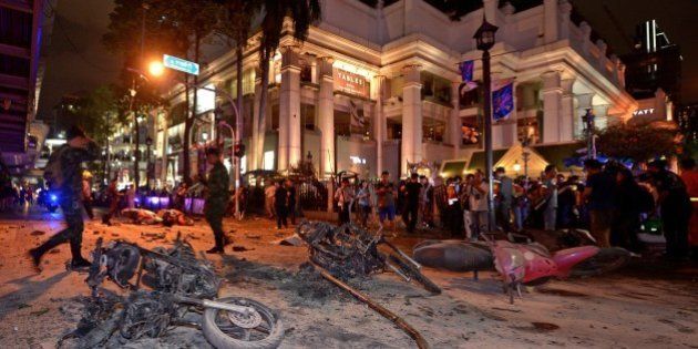 Thai soldiers inspect the scene after a bomb exploded outside a religious shrine in central Bangkok late on August 17, 2015 killing at least 10 people and wounding scores more. Body parts were scattered across the street after the explosion outside the Erawan Shrine in the downtown Chidlom district of the Thai capital. AFP PHOTO / PORNCHAI KITTIWONGSAKUL (Photo credit should read PORNCHAI KITTIWONGSAKUL/AFP/Getty Images)
