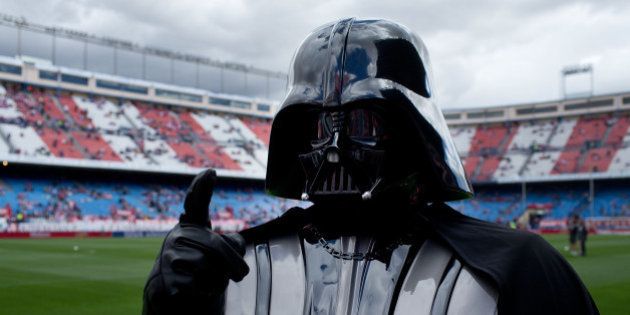 MADRID, SPAIN - APRIL 05: A man dressed up as Darth Vader of Stars War film walks on the pitch prior to start the La Liga match between Club Atletico de Madrid and Villarreal CF at Vicente Calderon Stadium on April 5, 2014 in Madrid, Spain. (Photo by Gonzalo Arroyo Moreno/Getty Images)