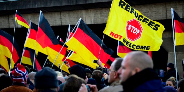 COLOGNE, GERMANY - JANUARY 09: Supporters of Pegida, Hogesa (Hooligans against Salafists) and other right-wing populist groups gather to protest against the New Year's Eve sex attacks on January 9, 2016 in Cologne, Germany. Over 100 women have filed charges of sexual molestation, robbery and in two cases, rape, stemming from aggressive groping and other behavior by gangs of drunken men described as Arab or North African at Hauptbahnhof on New Year's Eve. Over 100 women have filed charges of sexual molestation, robbery and in two cases, rape, stemming from aggressive groping and other behavior by gangs of drunken men described as Arab or North African at Hauptbahnhof on New Year's Eve. Police have recently stated that at least some of the men identified so far are refugees, which is feeding the propaganda of right-wing groups opposed to Germany's open-door refugee policy. Germany took in approximately 1.1 million migrants and refugees in 2015. (Photo by Sascha Schuermann/Getty Images)