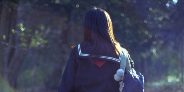 School girl walking up the steps