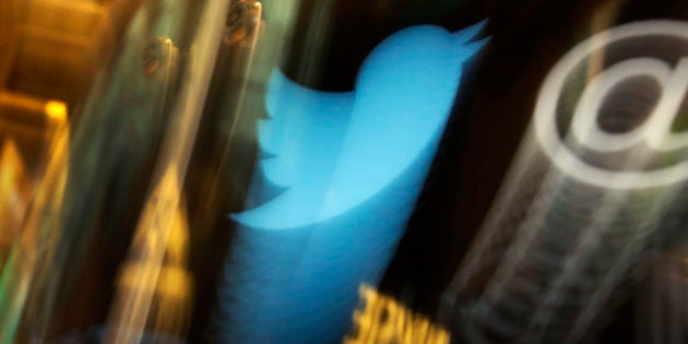 FILE - In this Wednesday, Nov. 6, 2013, file photo, the Twitter logo appears on an updated phone post on the floor of the New York Stock Exchange. Twitter reports financial results Thursday, Oct. 27, 2016. (AP Photo/Richard Drew, File)