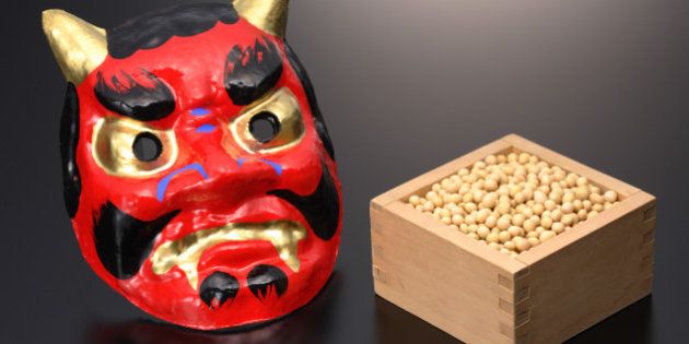 Japanese 'Oni' devil mask with box of 'edamame' soybeans