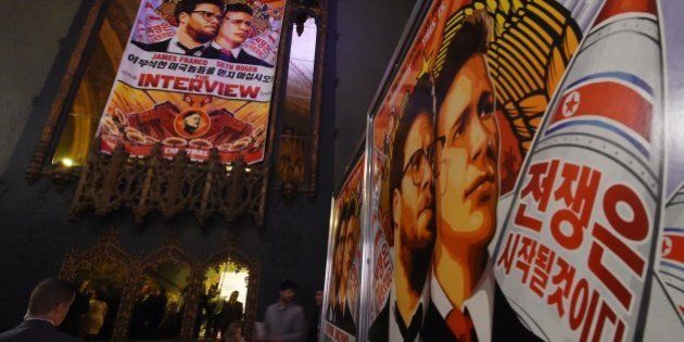 Movie posters for the premiere of the film 'The Interview' at The Theatre at Ace Hotel in Los Angeles, California on December 11, 2014. The film, starring US actors Seth Rogen and James Franco, is a comedy about a CIA plot to assassinate its leader Kim Jong-Un, played by Randall Park. North Korea has vowed 'merciless retaliation' against what it calls a 'wanton act of terror' -- although it has denied involvement in a massive cyber attack on Sony Pictures, the studio behind the film. AFP PHOTO/STR (Photo credit should read -/AFP/Getty Images)