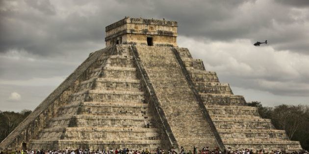 Thousands of tourists surround the Kukulcan Pyramid at the Chichen Itza archeological site during the celebration of the spring equinox in the Yucatan state, southeastern Mexico, on March 21, 2016. A 10-meter (33-foot) tall pyramid was found within another 20-meter structure, which itself is enveloped by the 30-meter pyramid visible at the Mayan archeological complex known as Chichen Itza in Yucatan state. / AFP / ALEJANDRO MEDINA (Photo credit should read ALEJANDRO MEDINA/AFP/Getty Images)