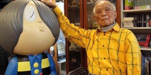 To go with Japan-history-WWII-anniversary-soldiers,FEATURE by Kyoko HASEGAWA This picture taken on May 12, 2015 shows Japanese 93-year-old comic artist Shigeru Mizuki showing his famous character 'Kitaro' as he speaks to AFP an reporter at his studio in Tokyo. Mizuki uses manga, graphic novels, to spread his message of the horror of war. In his works, including the award-winning 'Onward Towards Our Noble Deaths', Mizuki describes the lot of enlisted soldiers sent to New Britain island, now part of Papua New Guinea. In an essay with a hundred of sketches he drew as 'a war chronicle', Mizuki tells of how he was the only survivor when his unit came under attack in 1944. AFP PHOTO / Yoshikazu TSUNO (Photo credit should read YOSHIKAZU TSUNO/AFP/Getty Images)