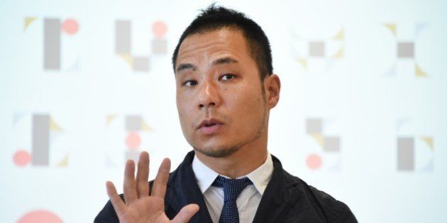 Tokyo Olympic logo designer Kenjiro Sano explains his design during a press conference at the headquarters of Tokyo 2020 in Tokyo on August 5, 2015. Sano denied plagiarism claims after his emblem triggered threats of possible legal action in Europe. AFP PHOTO / Toru YAMANAKA (Photo credit should read TORU YAMANAKA/AFP/Getty Images)