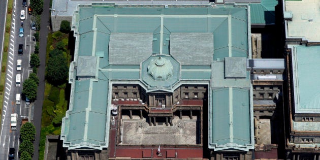 The Bank of Japan (BOJ) headquarters stands in this aerial photograph taken in Tokyo, Japan, on Wednesday, June 24, 2015. The Abe administration aims to cap increases in spending as it tries to rein in the world's heaviest debt load while sustaining a recovery from two decades of stagnation. Photographer: Kiyoshi Ota/Bloomberg via Getty Images