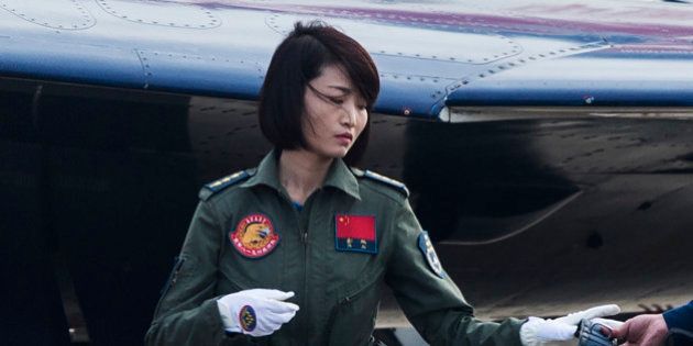 This picture taken on November 11, 2014 shows Chinese female J-10 fighter pilot Yu Xu getting ready to perform at the Airshow China in Zhuhai, south China's Guangdong province. TheThe first woman to fly China's J-10 fighter plane was killed in a crash during an aerobatics training exercise, state-run media reported on November 14, 2016. Yu Xu, 30, a member of the Chinese air force's 'August 1st' aerobatic display team, ejected from her aircraft during a training exercise in the northern province of Hebei at the weekend, the China Daily newspaper said. / AFP / JOHANNES EISELE (Photo credit should read JOHANNES EISELE/AFP/Getty Images)