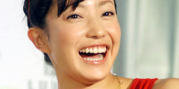 Japanese singer and actress Kanno Miho smiles at a media event to promo Lukia's new watch collection, Saturday, June 21, 2008, in Taipei, Taiwan. (AP Photo/Chiang Ying-ying)