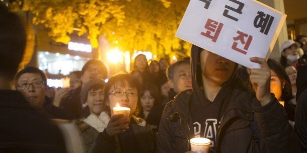 SEOUL, SOUTH KOREA - NOVEMBER 12: South Korean people march during a demonstration, demanding the resignation of South Korean President, Park Geun-hye at Gwanghwamun square in Seoul, South Korea on November 12, 2016. (Photo by Kim Jong-Hyun /Anadolu Agency/Getty Images)