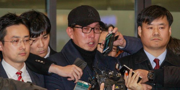 Cha Eun Taek of Choi Soon Sil confident, stand pose after arrives entry gate at international airport in Incheon, South Korea, on November 8, 2016. The Ministry of Culture, Sports and Tourism admitted that it granted favors to Cha Eun-taek, a TV commercials director and confidant of Choi Soon-sil, in funding and supporting Chas musical One Day, which President Park Geun-hye attended in 2014 and gave a rave review. (Photo by Seung-il Ryu/NurPhoto via Getty Images)