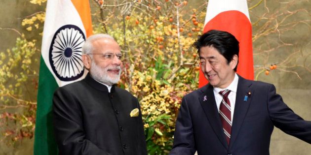 Indian Prime Minister Narendra Modi, left, is welcomed by his Japanese counterpart Shinzo Abe upon his arrival for their meeting at Abe's official residence in Tokyo, Friday, Nov. 11, 2016. Modi is visiting Japan on a three-day visit. (Toru Yamanaka/Pool Photo via AP)