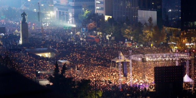 South Korean protesters stage a rally calling for South Korean President Park Geun-hye to step down in downtown Seoul, South Korea, Saturday, Nov. 5, 2016. Tens of thousands of South Koreans poured into the streets of downtown Seoul on Saturday, using words including